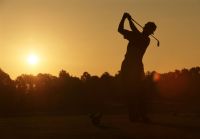 golfer in orange sunset