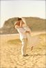 bride and groom on sandy beach